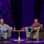 Brett 'Hitman' Hart being interviewed on stage by local Ottawa comedian on stage at the Algonquin Commons Theatre