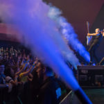 Fog machines shoot out over the floor level audience while Simple Plan plays near the front of the stage at the Algonquin Commons Theatre